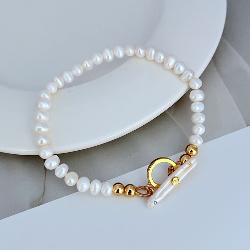 Freshwater pearl bead bracelet with gold OT clasp and circular ring hardware