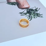 Gold openwork logo metal ring, textured lattice band