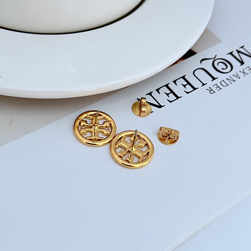 Gold-tone round logo stud earrings showing post backs and openwork metal emblem