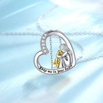 Sterling silver heart pendant necklace with mother-and-child figures, gold bow and message