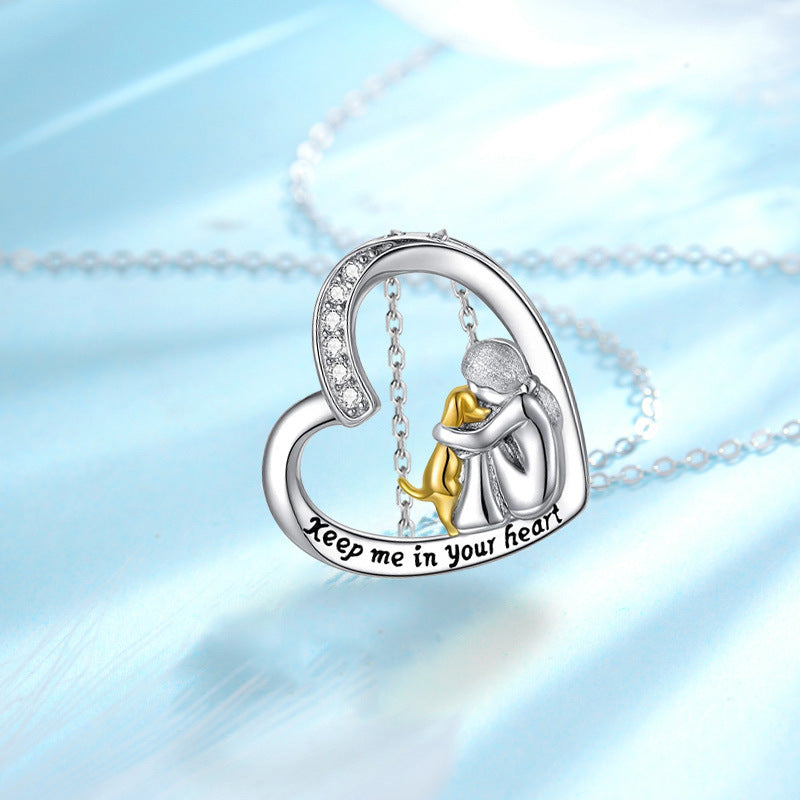 Sterling silver heart pendant necklace with mother-and-child figures, gold bow and message