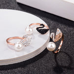 Rose-gold swan pearl open ring with white pearl, black swan head, and crystal accents