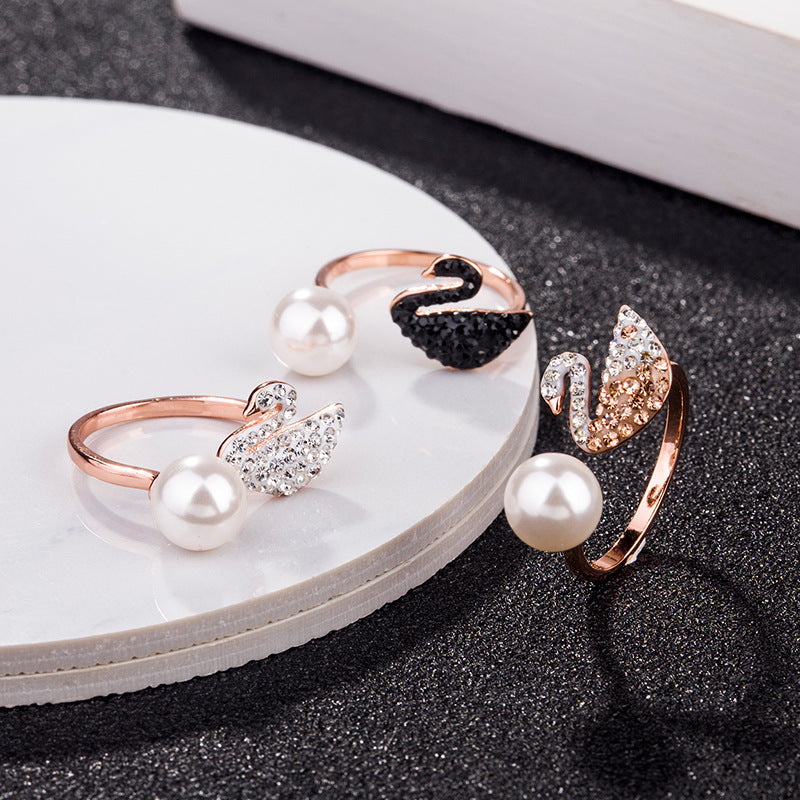 Rose-gold swan pearl open ring with white pearl, black swan head, and crystal accents