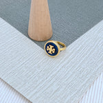 Round enamel metal ring with dark blue shell center and gold-tone bezel
