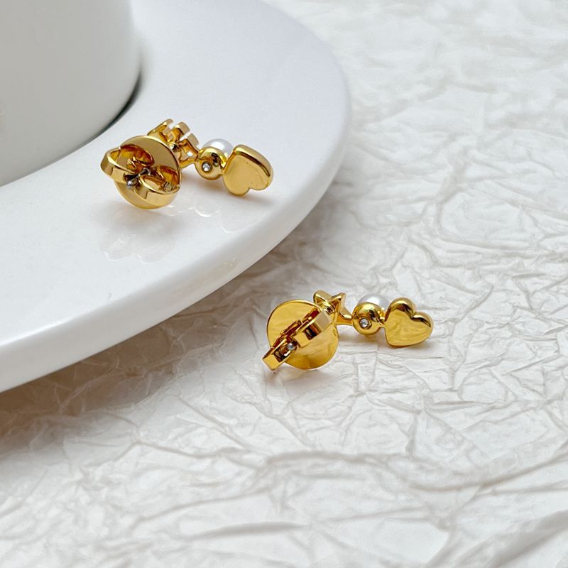 Gold-tone back view of heart and star earrings with white pearl accents