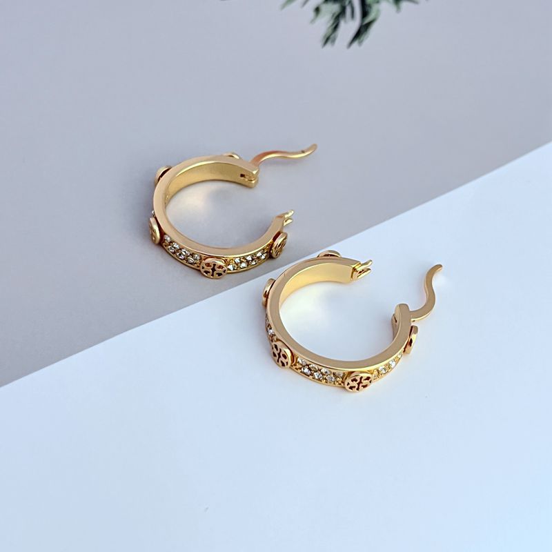 Gold hoop earrings with round logo charm and crystal pavé trim