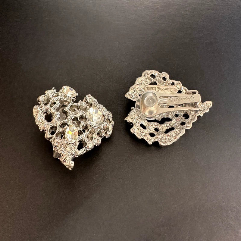 White gold-tone openwork heart clip-on earrings with hinge and clasp