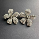 Large flower stud earrings with clear rhinestone petals, silver-tone hardware