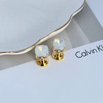 Geometric square stud earrings with off-white rhinestones and gold-tone posts