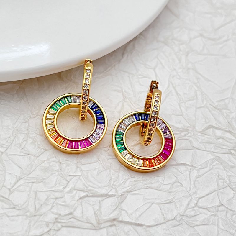 Pair of gold-tone zircon donut hoop earrings with rainbow multicolor outer ring