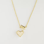 Heart and music note pendant necklace with white heart, gold-tone chain