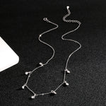 Silver-tone S925 geometric teardrop zircon necklace with linked chain and dangling stones