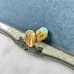 Ice-cream enamel studs, mint green domes with gold-tone bow-shaped detail