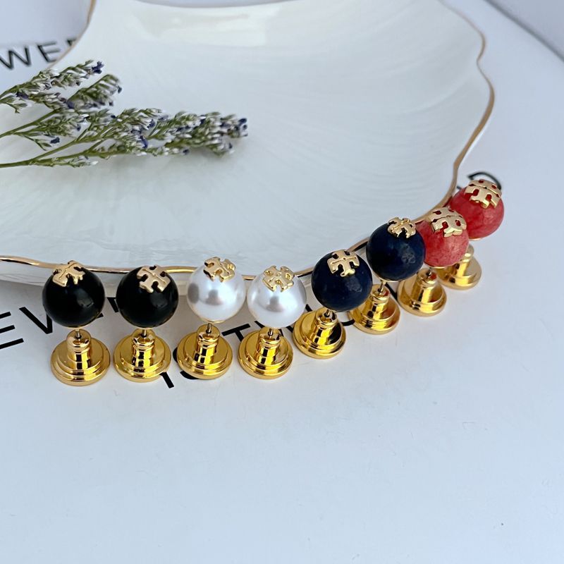 Geometric pearl stud earrings set with black, white, navy and gold-tone round spheres