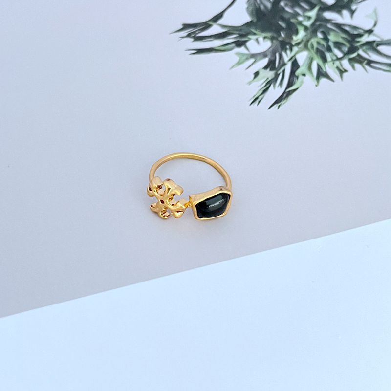 Logo acrylic matte metal ring with black acrylic stone, gold-tone band