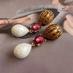 Pearl drop crystal earrings with rose-red oval stones and gold-tone hoop settings