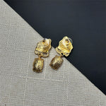 Gold-tone earring backs with hoop posts