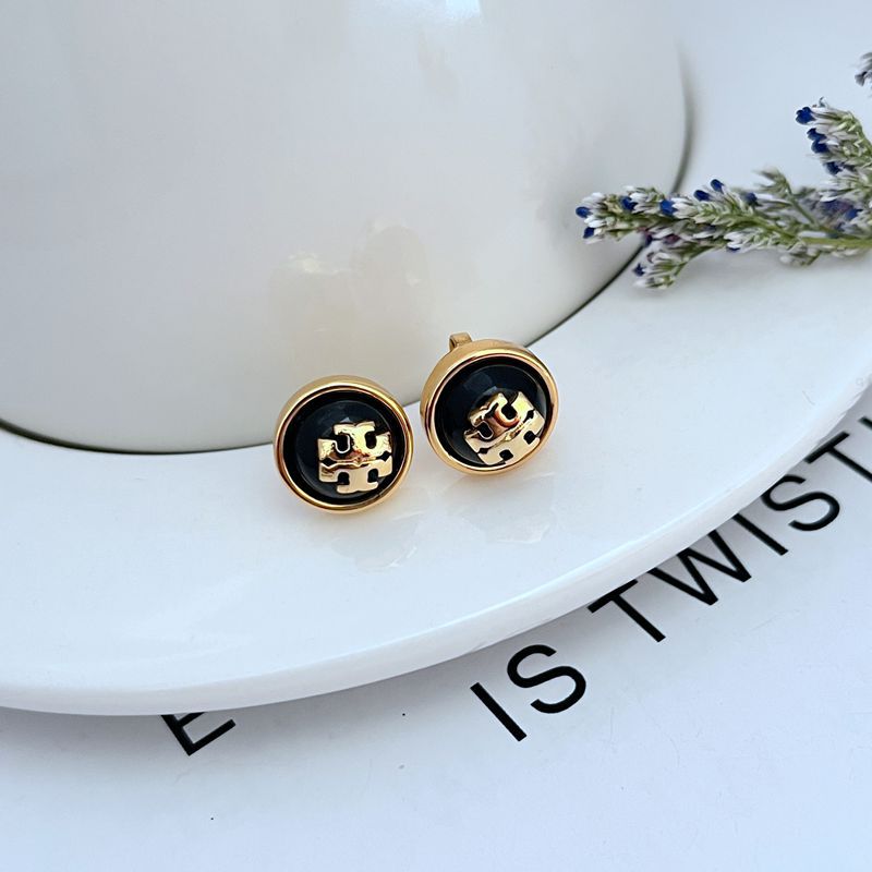 Round logo resin stud earrings, black resin center with gold-tone trim