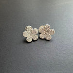 Diamond floral stud earrings in silver with clear stones