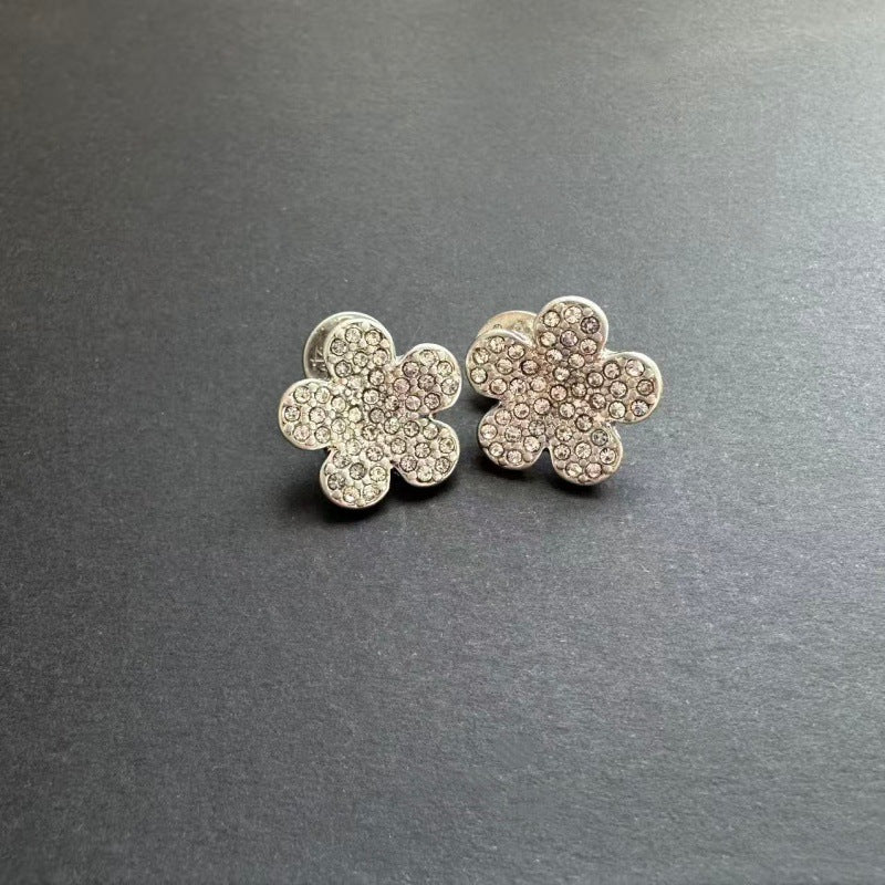 Diamond floral stud earrings in silver with clear stones