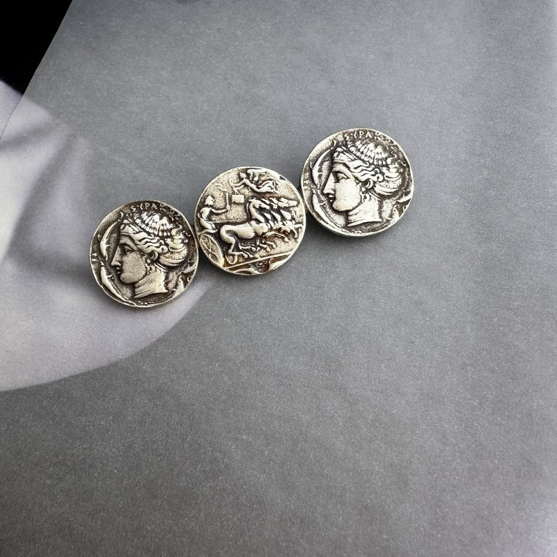 Ancient coin brooch with three distressed silver coin medallions