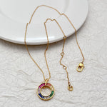 Gold-tone necklace chain with multicolor zircon donut pendant and matching hoop charm