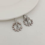 Silver-tone hoop pendant earrings with rhinestones and gray pearl drops