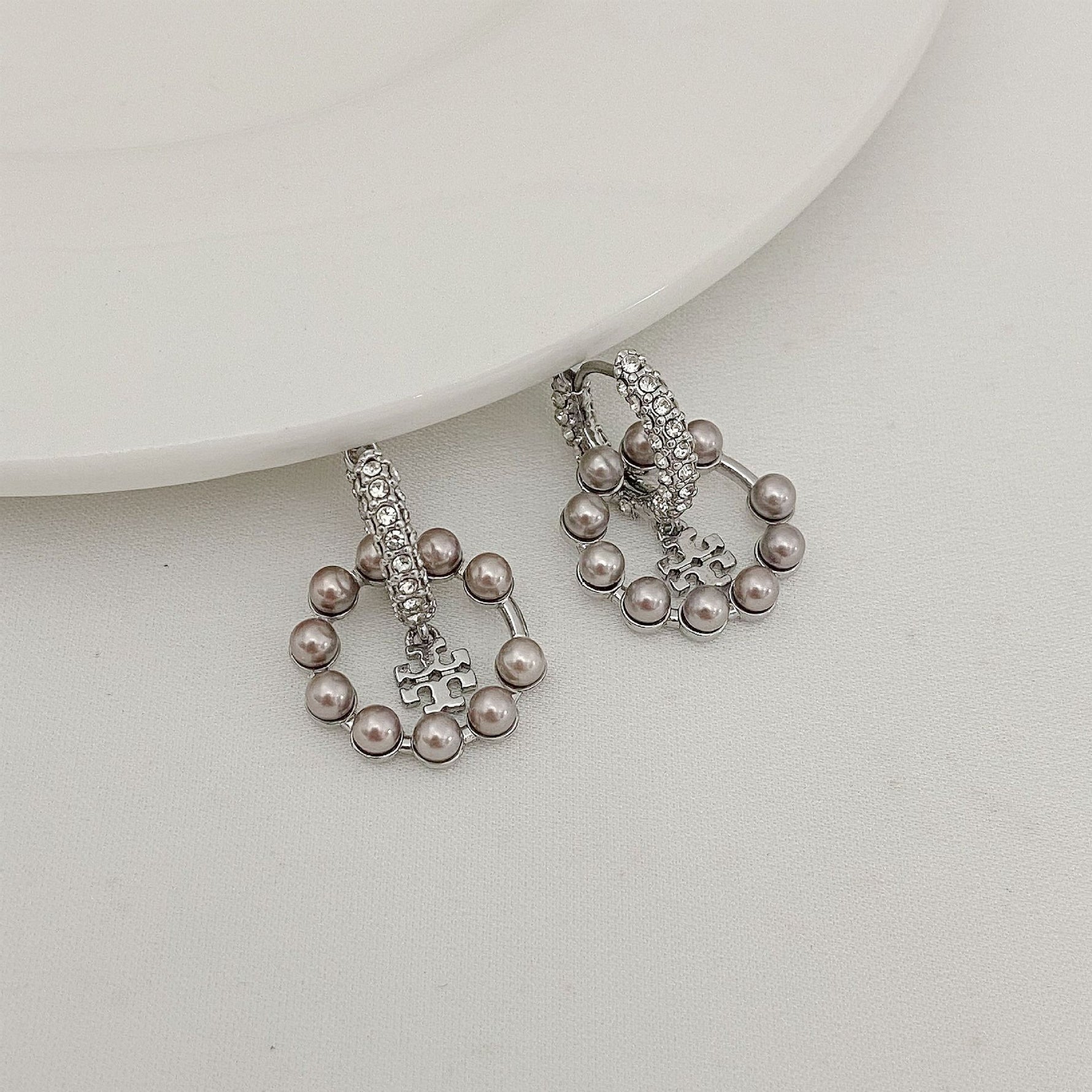 Silver-tone hoop pendant earrings with rhinestones and gray pearl drops