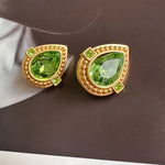 Green crystal heart stud clip-on earrings with gold bezel and small green squares