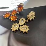 Cactus-cut sparkling glass diamond ear clips with orange stones and gold-tone back clips
