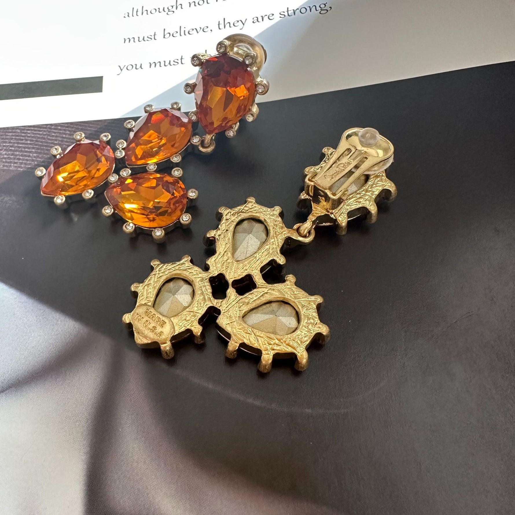 Cactus-cut sparkling glass diamond ear clips with orange stones and gold-tone back clips