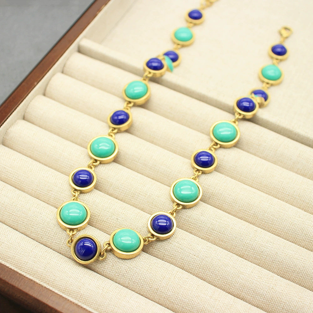 Gold-tone stone bracelet and necklace set with turquoise and dark blue round beads
