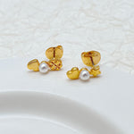Gold-tone stud earrings with white pearls, heart and star charm design