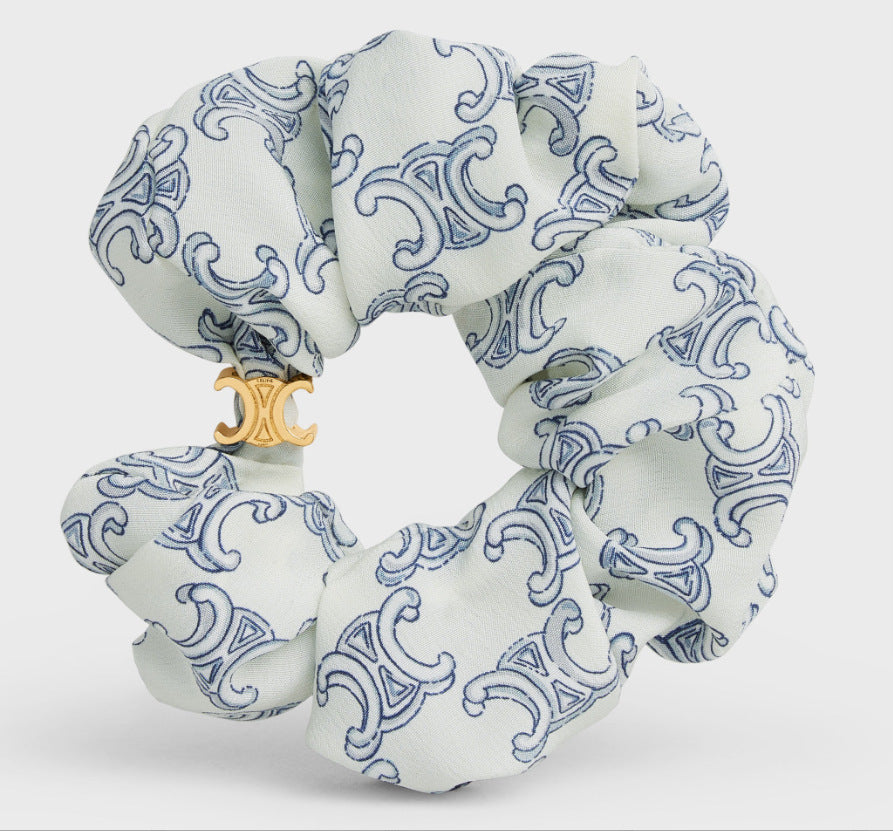 Fabric hair tie, white with blue swirl baroque pattern and gold-tone charm