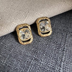 Square crystal stud earrings with clear/white square stones in gold-tone frames
