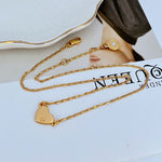 Gold heart pendant necklace with round clasp and curb-link chain