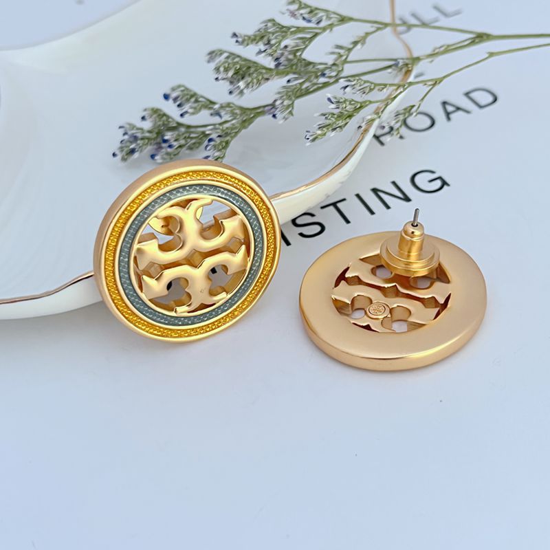 Gold round enamel openwork earrings with stud posts, geometric cutout front