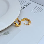 Petite U-shaped hoop earrings, gold tone with hinged clasp detail