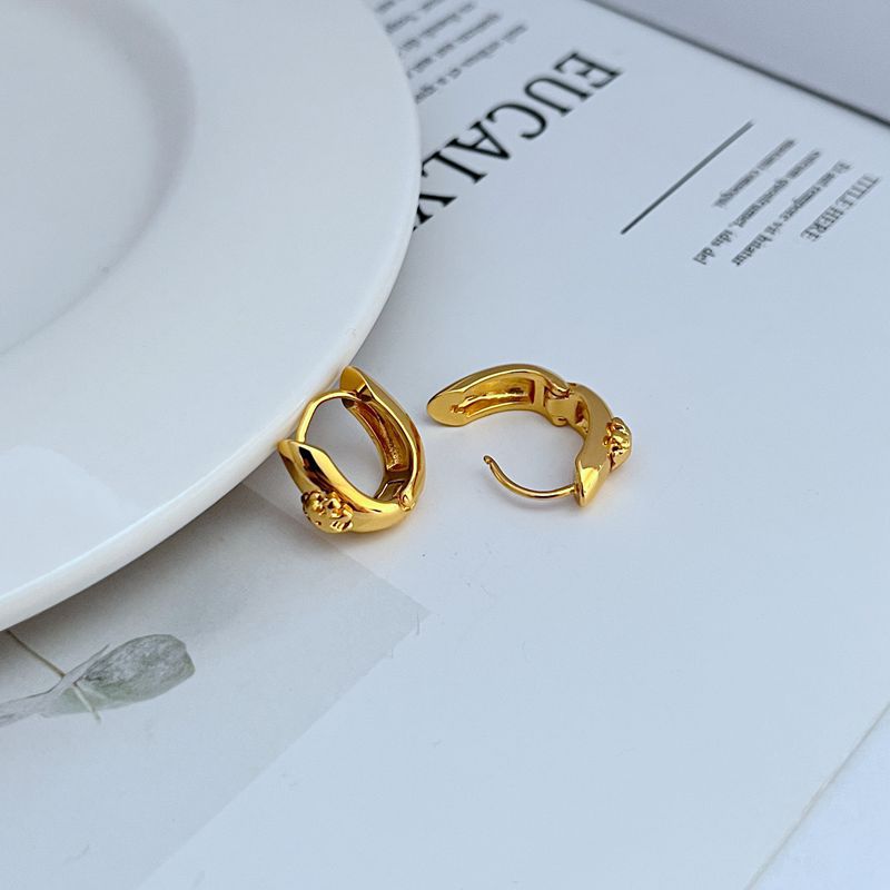Petite U-shaped hoop earrings, gold tone with hinged clasp detail