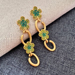 Gold floral drop earrings with green and clear crystal clover and hoop drops