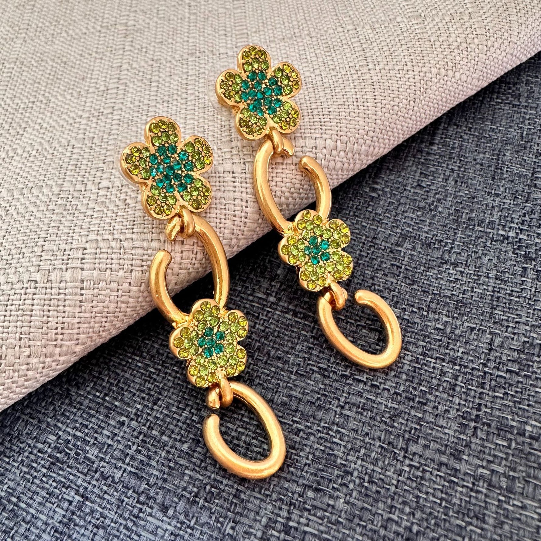 Gold floral drop earrings with green and clear crystal clover and hoop drops