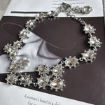 Silver-tone crystal necklace with clear oval faceted stones and link chain