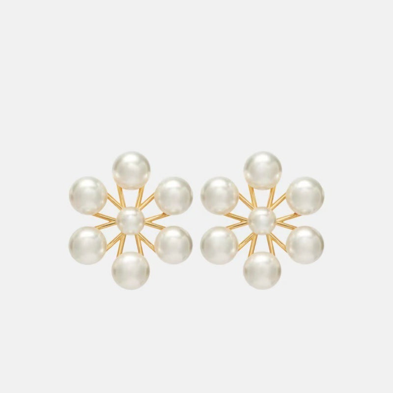 Gold-tone pearl floral stud earrings with circular petal design, six round pearls