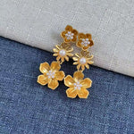 Enamel plum blossom drop earrings, gold-tone blossoms with pearl centers and dangling drops