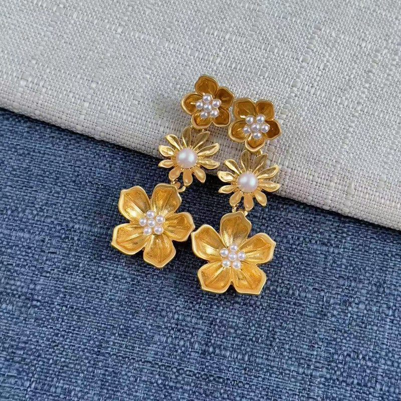 Enamel plum blossom drop earrings, gold-tone blossoms with pearl centers and dangling drops