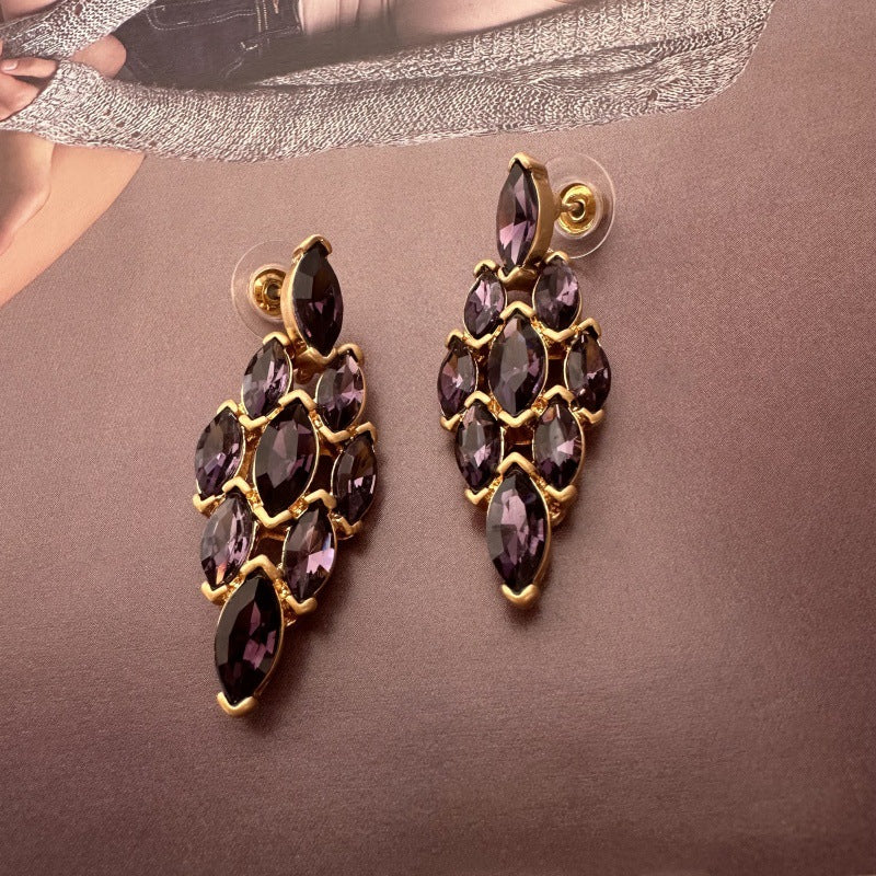 Dark purple marquise rhinestone earrings with diamond-shaped cluster and gold-tone posts