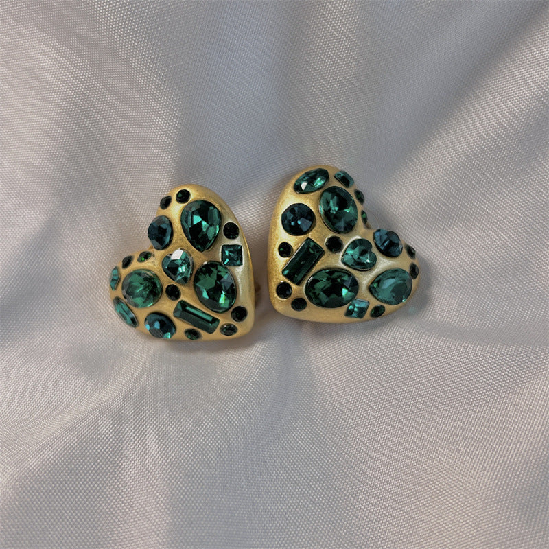 Gold-tone heart crystal stud earrings with dark green teardrop and round stones
