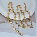 Gold four-leaf clover sweater chain with linked clover charms and clasp