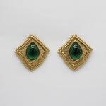Hammered quadrilateral earrings with green teardrop stones in gold frames