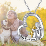 Heart-shaped pendant necklace with mother-and-child figures, gold accents and 'Keep me in your heart'